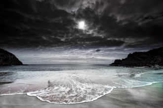 Dramatic coastal landscape near Western River Cove with stormy sea and dark sky, Kangaroo Island,