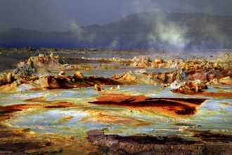 Dramatic geothermal scene in Dallol with smoke and mineral-rich rocks, Dallol, Afar region,