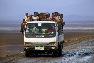 Truck with people in desert landscape, Dallol, Asale, Ethiopia