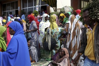 People wearing colorful clothes at a market, hustle and bustle, Awaday, Ethiopia