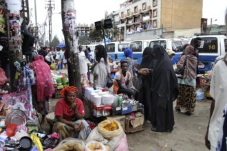 Grocery store on a busy street with woman wearing hijab, Addis Ababa, Mercato, Ethiopia