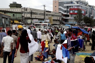 Bustling market area with lots of people and an urban backdrop, Addis Ababa, Mercato, Ethiopia