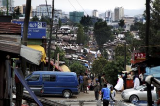 Busy street view in the Mercato of Addis Ababa with people and vehicles, Addis Ababa, Ethiopia