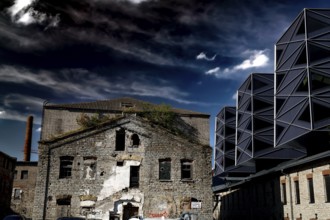 Contrast between historic and modern architecture in the Rotermann quarter, gloomy sky, Tallinn,