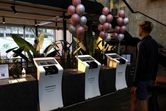 Check-in area at Hotel City Box Tallinn with modern terminals and decoration in the Rotermann