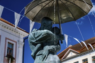 Close-up view of the sculpture of students kissing with umbrella, a landmark of Tartu, against the