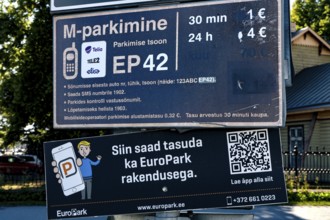 Parking sign with price information and QR code in Tallinn, Tallinn, Kelmiküla, Estonia