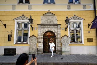 The magnificent façade of the Guild House in the Old Town attracts tourists with its architecture,
