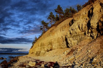 Atmospheric cliffs at sunset with rocks and trees, Panga, Saaremaa, Estonia