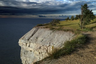 Dramatic cliffs of Panga overlooking the sea under an impressive sky, Panga, Saaremaa, Estonia