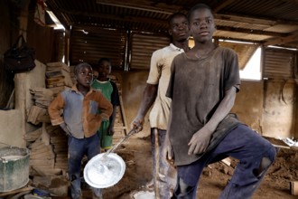 Young pot makers in their workshop showing the craft process, Korhogo, CI, West Africa