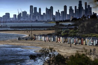 Colourful beach boxes on Brighton beach with views of Melbourne's skyline, Brighton Beach,