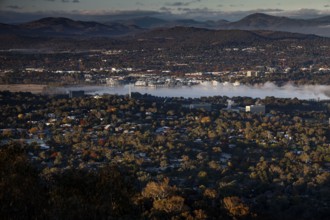 Panoramic view from Mount Ainslie of Canberra's western suburbs and countryside at dusk, Canberra,
