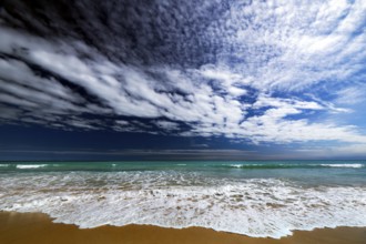 Dynamic cloud formations over the turquoise water of Cable Beach, Broome, Western Australia,