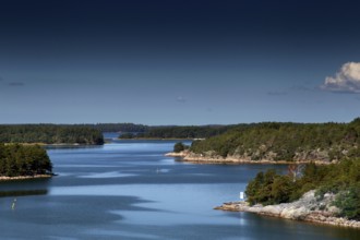 Tranquil view of an archipelago with numerous islands under clear skies