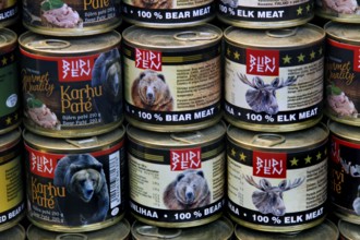 Interior view of a market hall with detailed canned goods with bear meat labels, Helsinki, Finland