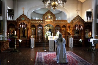 Interior view of Uusi Valamo monastery in Heinävesi during a church service with an impressive