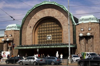 Helsinki's main station portal, a mix of historic architecture and bustling city life, Helsinki,