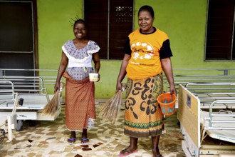 Patients clean the area in a psychiatric rehabilitation center, CI Bouaké, Ivory Coast