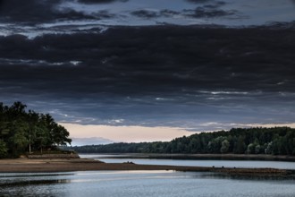View of the Duna (Daugava) with forested bank and clouds, Koknese, Daugava, Latvia