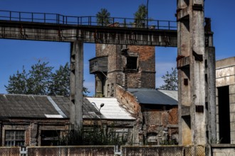 Former factory site with brick structures and blue sky, Daugavpils, Latvia