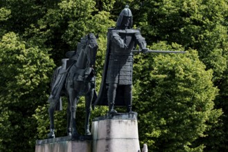 Gediminas monument in front of thick trees on Cathedral Square, Vilnius, Lithuania