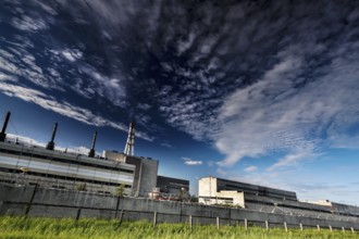 Wide angle view of abandoned power plant under dramatic sky, Visaginas, Lithuania