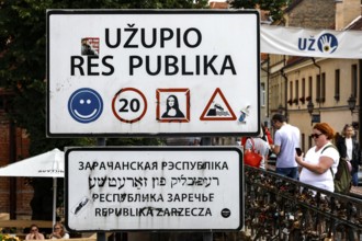 Užupis Republic border sign with pictograms and multilingual inscriptions, Vilnius, Užupis,