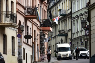 Busy street with cars and flags in the artistic district of Vilnius' Užupis, Vilnius, Užupis,