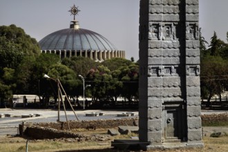 Stele park in Axum with prominent stele and St. Mary's Cathedral in the background, Axum, Ethiopia