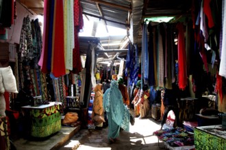 Woman at a colorful textile market in Babile, Babile, Ethiopia