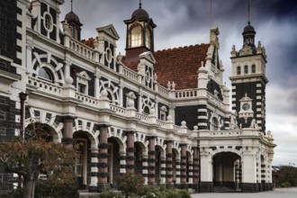 Historic Dunedin railway station façade with eye-catching towers and ornaments, Dunedin, null, New