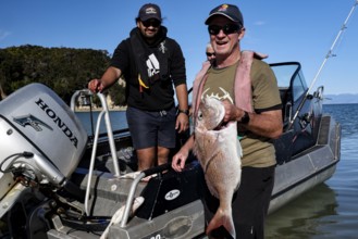 Anglers with Red Snapper on a boat near Adele Island, Adele Island, Abel Tasman National Park, New