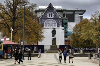 Cathedral and monument at Cathedral Square in Christchurch with passers-by, Christchurch,