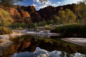 Fascinating rock formations in Purnululu NP reflected in a silent waterhole, Purnululu National