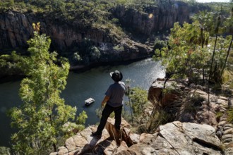 Man stands on rocks and looks at Kathrine Gorge at Pat's Lookout in Nitmiluk National Park,