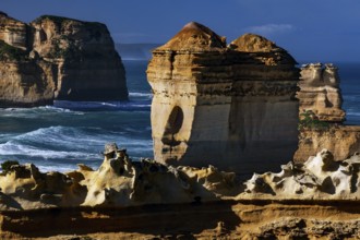 Massive rock formations of the Razorback off the stormy coast, Great Ocean Road, Victoria,