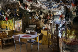 Quiet dining area in a cave filled with decorations in Coober Pedy, Coober Pedy, South Australia,