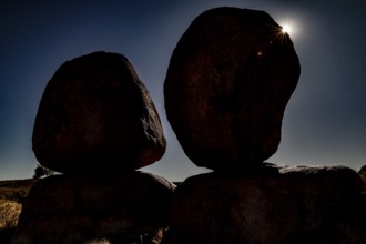 Silhouette of large rocks in sunlight that create a dramatic atmosphere in darkness, zero