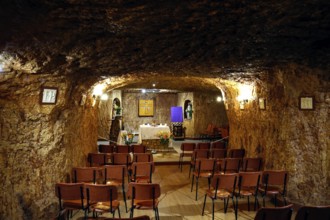 Underground chapel in Coober Pedy with standing pews and altar table, Coober Pedy, South Australia,