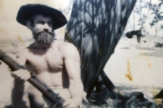 Crocodile Harry posing with hat and beard in natural setting, Coober Pedy, South Australia,