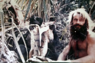 Portrait of Crocodile Harry amidst thick bushes in Coober Pedy, Coober Pedy, South Australia,
