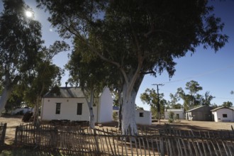 White church and trees in a mission station in Hermannsdorf