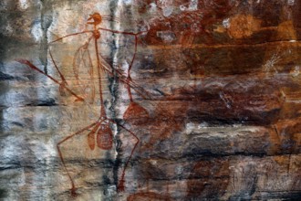Rock painting of a stylized man on a rock in Ubirr, Ubirr, Northern Territory, Australia