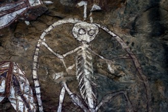 Traditional Aboriginal rock painting of an anthropomorphic being, Nourlangie, Northern Territory,