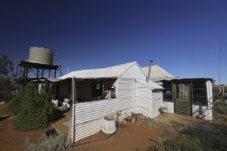 Building with water tower under clear sky of Old Andado Station, Old Andado Station, Australia