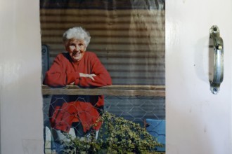 Portrait of Molly Clark in red outfit on the porch, zero