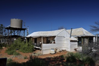Old Andado Station water tank building under blue sky, Old Andado Station, Northern Territory,