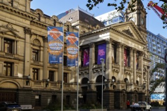 Historic Town Hall on Swanston Street in Melbourne with decorative posters, Melbourne, Victoria,