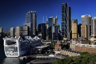 View of Sydney skyline with a large cruise ship in the foreground, Sydney, New South Wales,